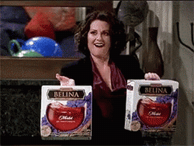 Woman Holding Two Boxes Of Belina Wine GIF