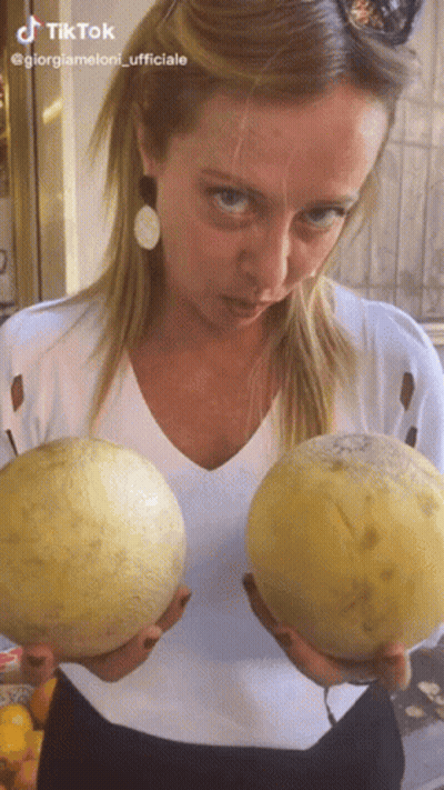 Woman Holding Two Cantaloupes With TikTok Logo GIF