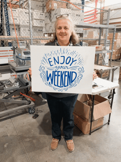 Woman Holding Weekend Sign GIF
