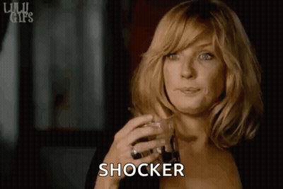 Woman Holding Whiskey Making Face GIF