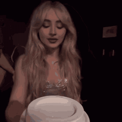 Woman Holding White Cake GIF