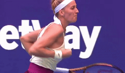 Woman Holding Wilson Tennis Racket GIF