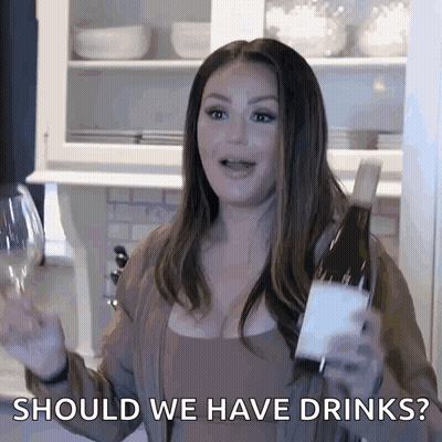Woman Holding Wine Asks Should We Have Drinks GIF