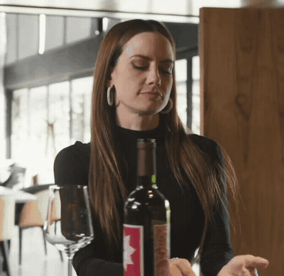 Woman Holding Wine Bottle GIF