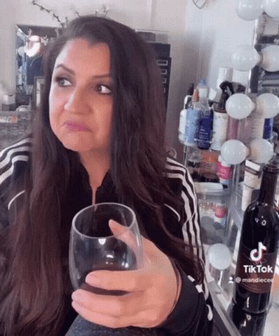 Woman Holding Wine Glass GIF