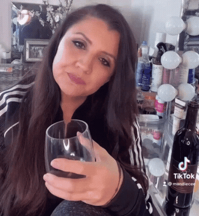 Woman Holding Wine Glass GIF