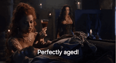 Woman Holding Wine Glass Perfectly Aged GIF
