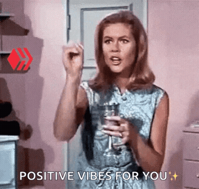 Woman Holding Wine Glass Saying Positive Vibes GIF