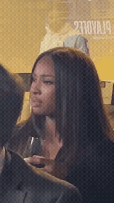 Woman Holding Wine In Front Of Sign Saying 23Nova 19 GIF