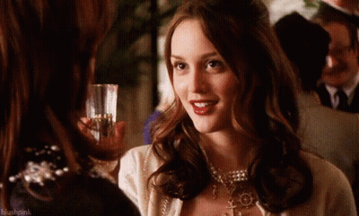 Woman Holding Wine Next To Woman With Blushpink GIF