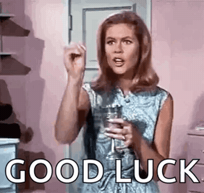 Woman Holding Wine Saying Good Luck GIF