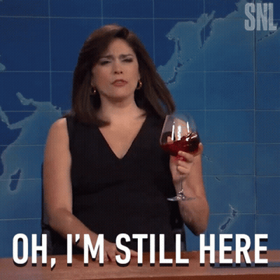 Woman Holding Wine Saying Oh I'm Still Here GIF