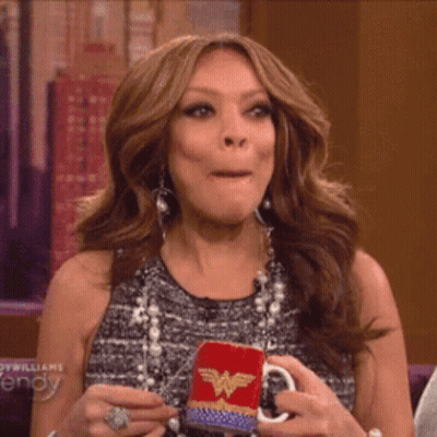 Woman Holding Wonder Woman Mug Making Face GIF