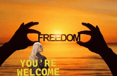 Woman Holding Word Freedom At Sunset GIF