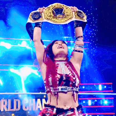 Woman Holding World Heavyweight Championship Belt Overhead GIF