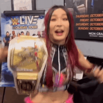 Woman Holding Wrestling Championship Belt At W Live Holiday Tour GIF