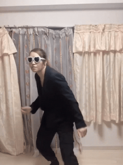 Woman Holding Wrestling Championship Belt On Stage GIF