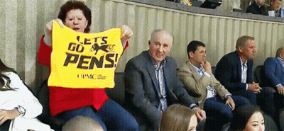 Woman Holding Yellow Shirt Saying Let's Go Pens GIF