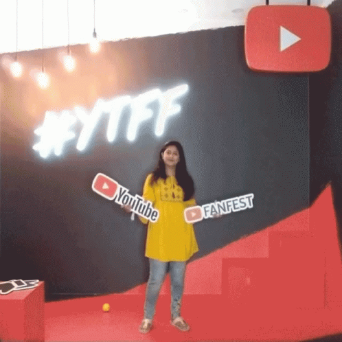 Woman Holding YouTube FanFest Sign GIF