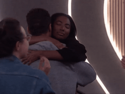 Woman Hugging Man In Room GIF