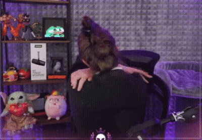 Woman Hugging Man In Stuffed Animal Room GIF