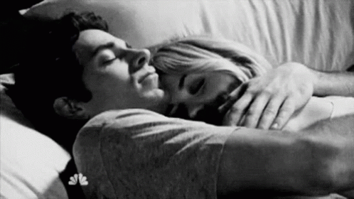 Woman Hugging Man On Couch GIF