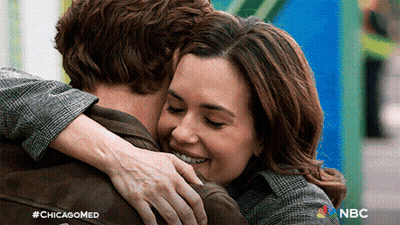 Woman Hugging Man With Chicagomed Logo GIF