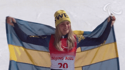 Woman In 20 Shirt Holding Flag GIF