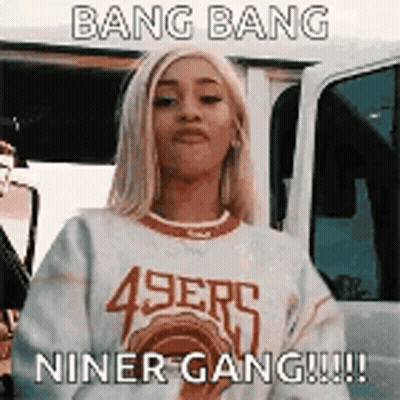 Woman In 49Ers Sweater Standing In Front Of Car GIF