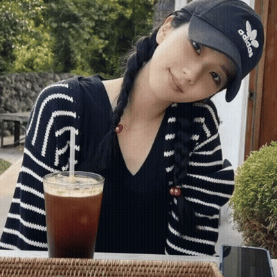 Woman In Adidas Hat Sitting At Table GIF