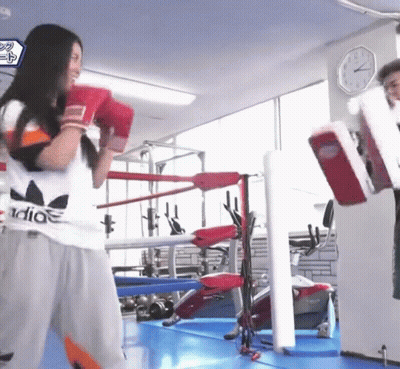 Woman In Adidas Shirt Wearing Boxing Gloves GIF