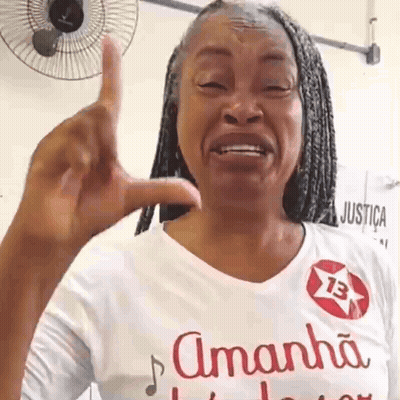 Woman In Amanha Shirt Giving Middle Finger GIF