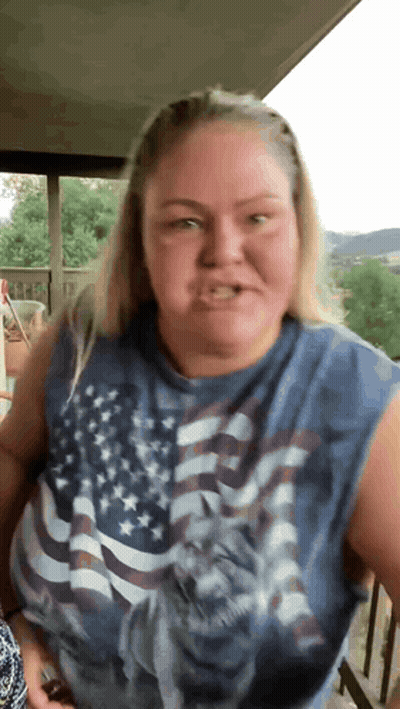 Woman In American Flag Sleeveless Shirt GIF