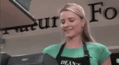 Woman In Apron At Cash Register GIF