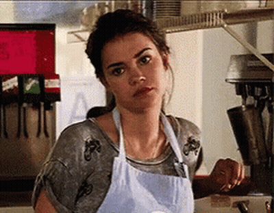 Woman In Apron Before Machine With Letter A GIF