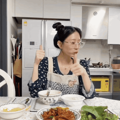 Woman In Apron Giving Thumbs Up GIF