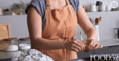 Woman In Apron Preparing Food With Food52 GIF