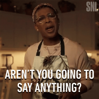 Woman in Apron Saying Aren't You Going To Say Anything