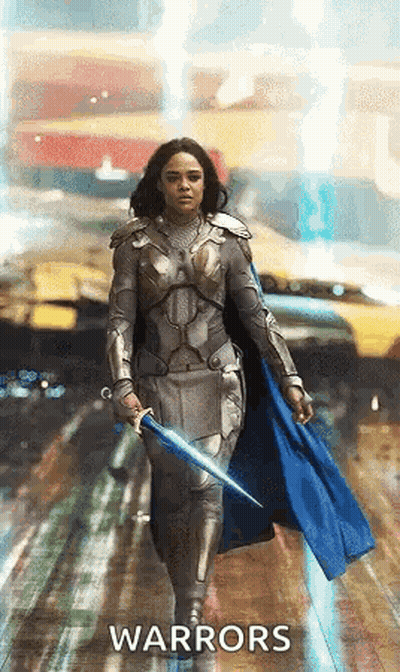 Woman In Armor Holding Sword And Cape GIF