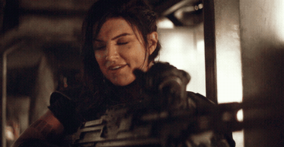 Woman In Armor Lying On Bed GIF