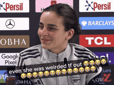 Woman In Arsenal Shirt Smiling In Front Of Persil And Barclays Ads GIF