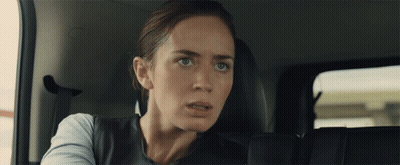 Woman In Back Seat Of Car Looking At Camera GIF