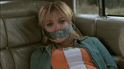 Woman In Back Seat With Duct Tape On Face GIF