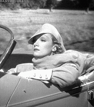 Woman In Back Seat With Hat And Scarf GIF