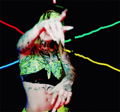Woman In Bandana And Crop Top Dancing In Dark Room GIF