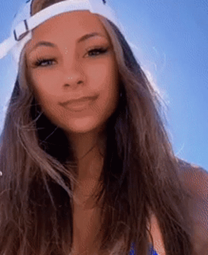 Woman In Baseball Cap And Blue Bikini Smiling GIF