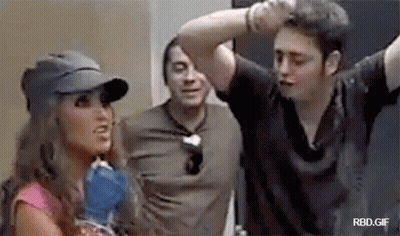 Woman In Baseball Cap Talking To Two Men GIF