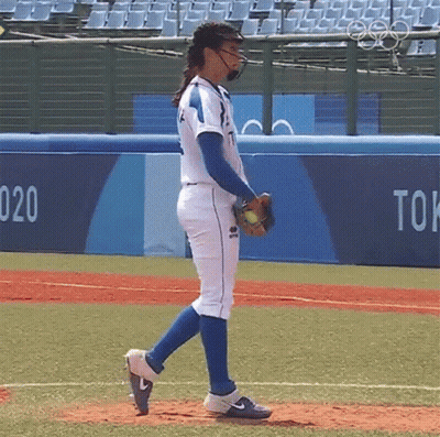 Woman In Baseball Uniform Walking On Field GIF