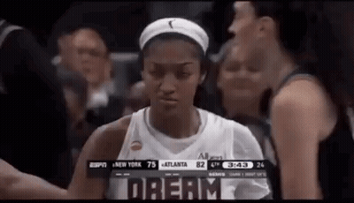 Woman In Basketball Uniform In Front Of Crowd GIF