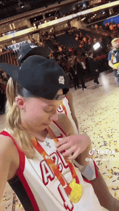 Woman In Basketball Uniform Taking Selfie With Medal GIF